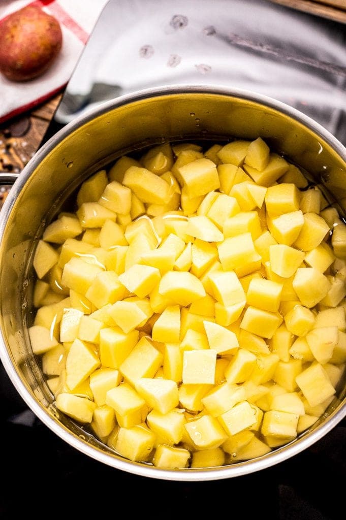 Diced potatoes in stock pot