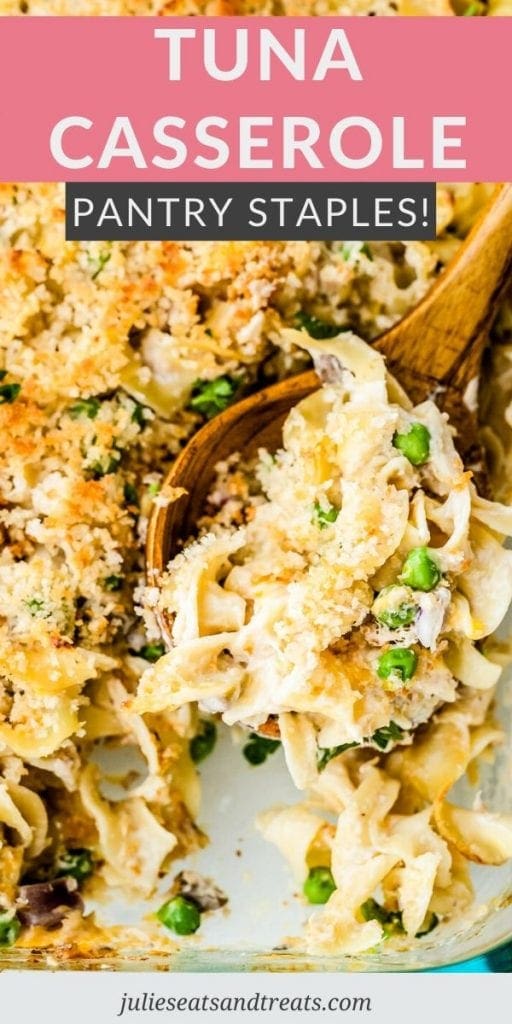 Tuna Casserole in a glass baking dish being scooped with a wooden spoon