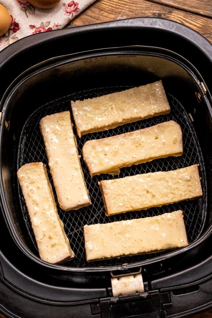 Battered slices of bread in air fryer basket