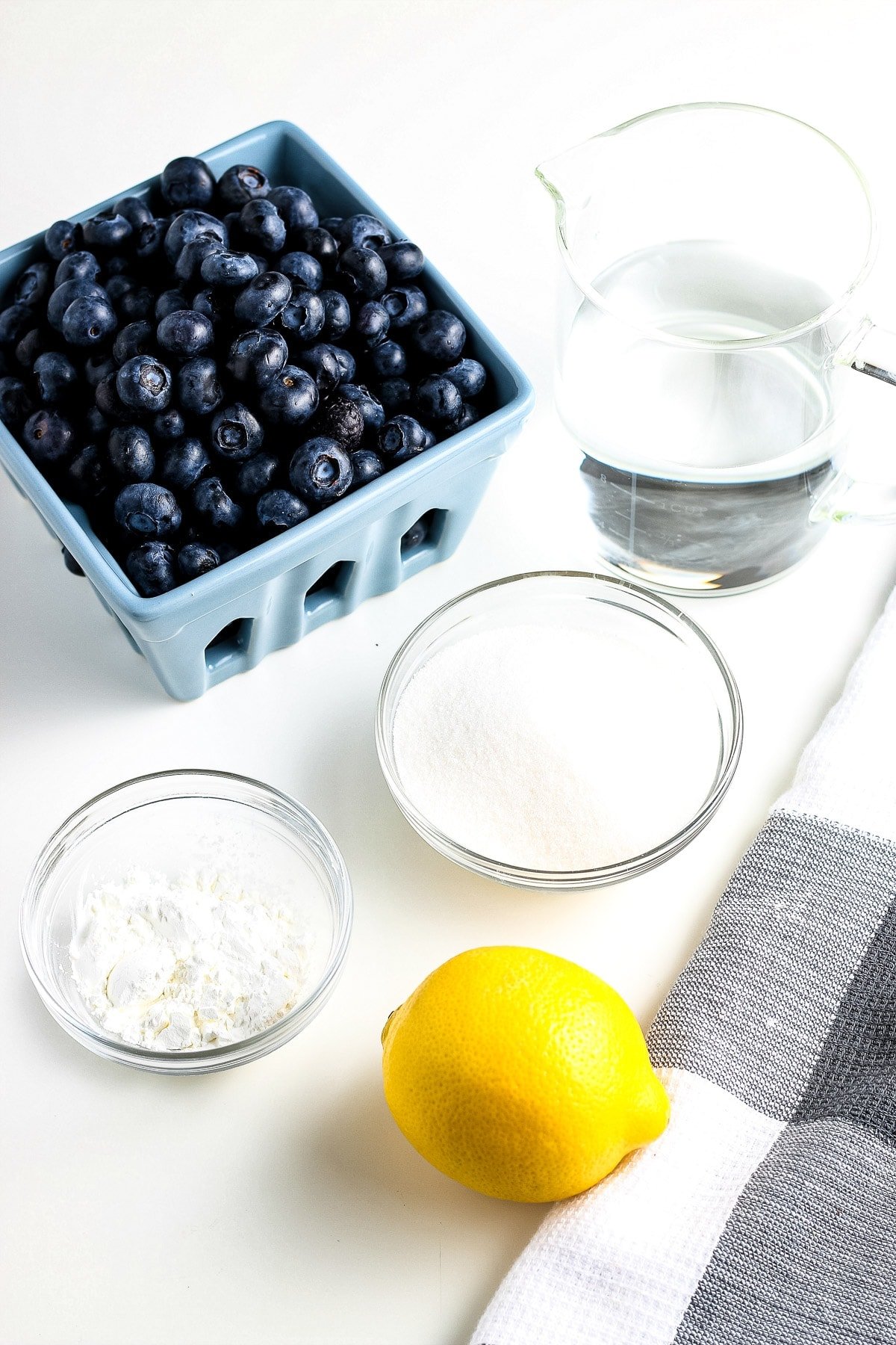 Overhead image of ingredients needed to make fresh blueberry sauce.