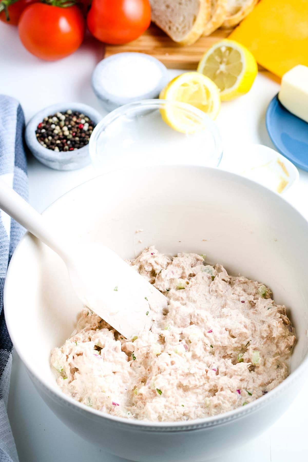 White bowl with tuna melt filling mixed together.