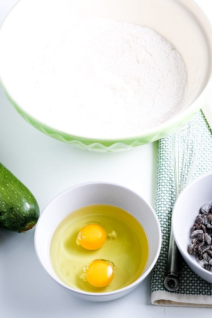 Eggs in bowl with oil before whisking.