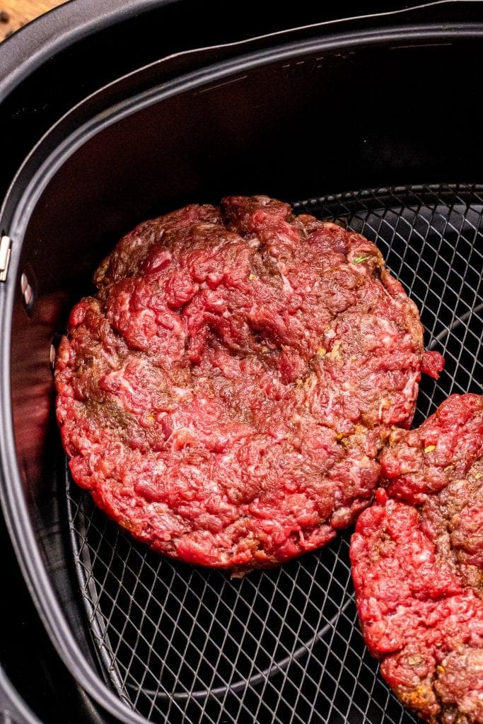 Hamburger patties in air fryer basket