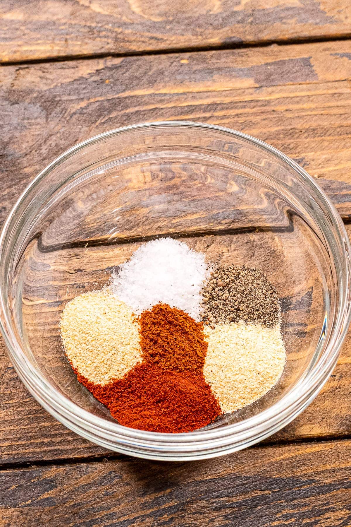 A bowl of seasonings before mixing together.