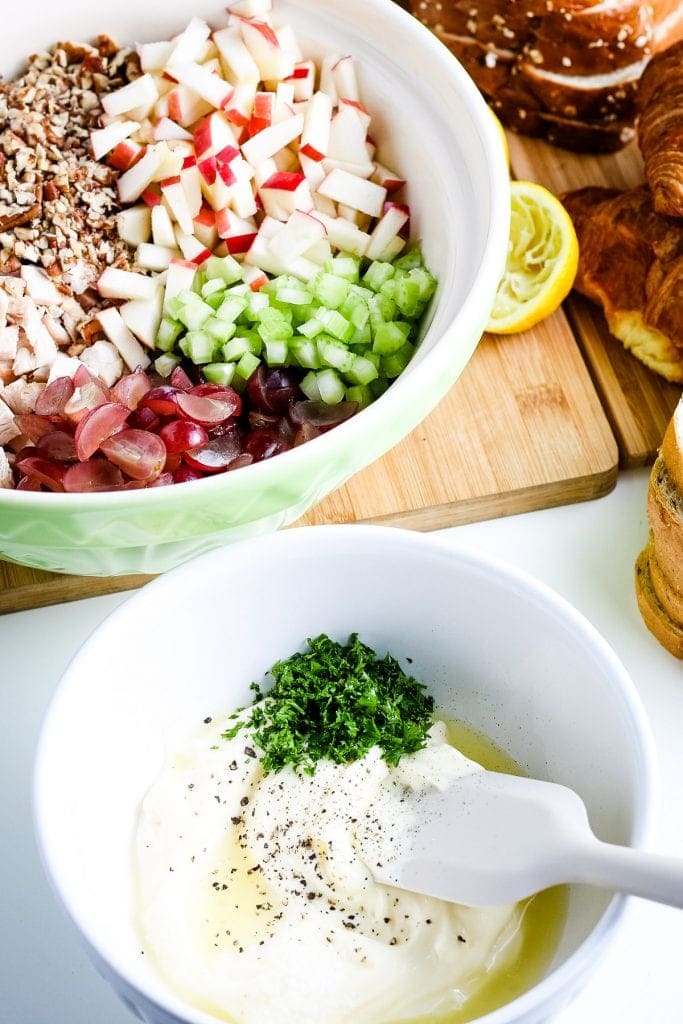 White bowl with dressing for chicken salad before mixing.