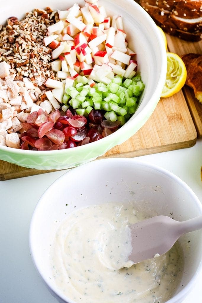 White bowl with dressing for chicken salad after mixing.