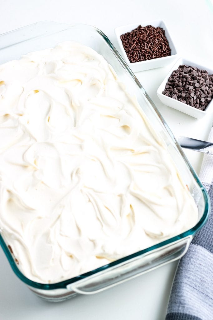 Glass baking dish with final cool whip layer on it.