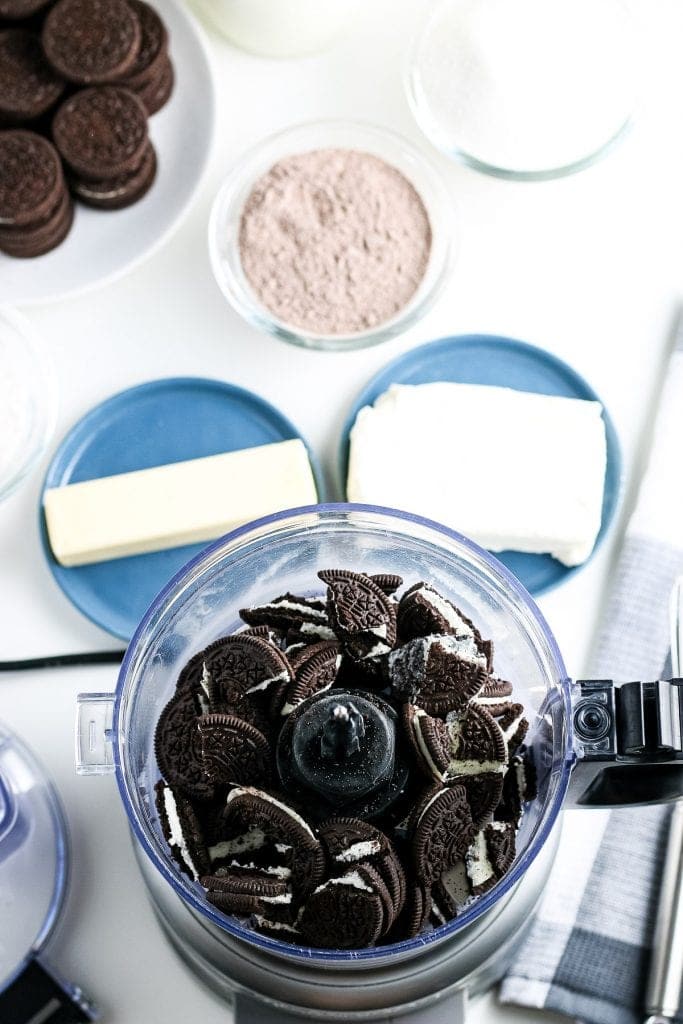 Food processor full of oreos before crushing.