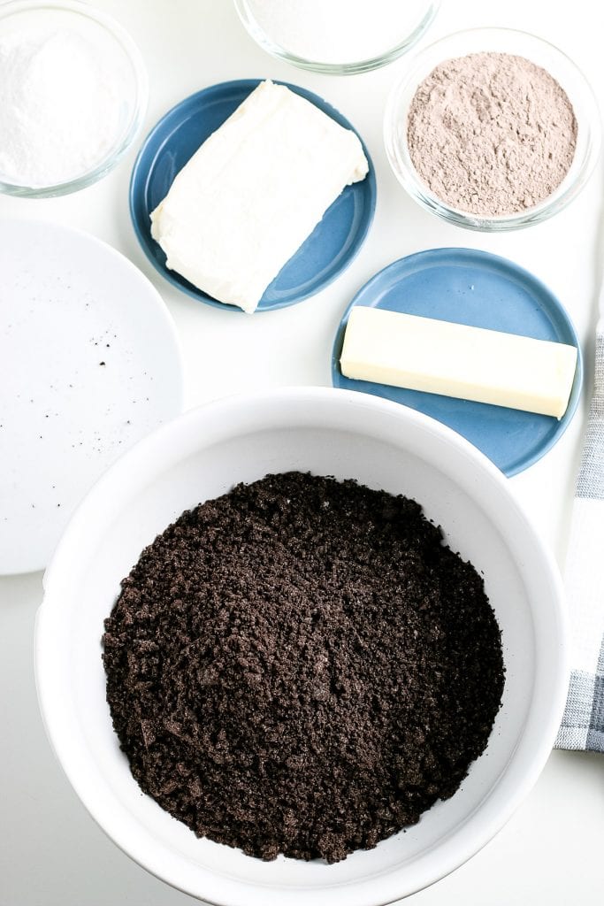 White bowl full of crushed Oreos.