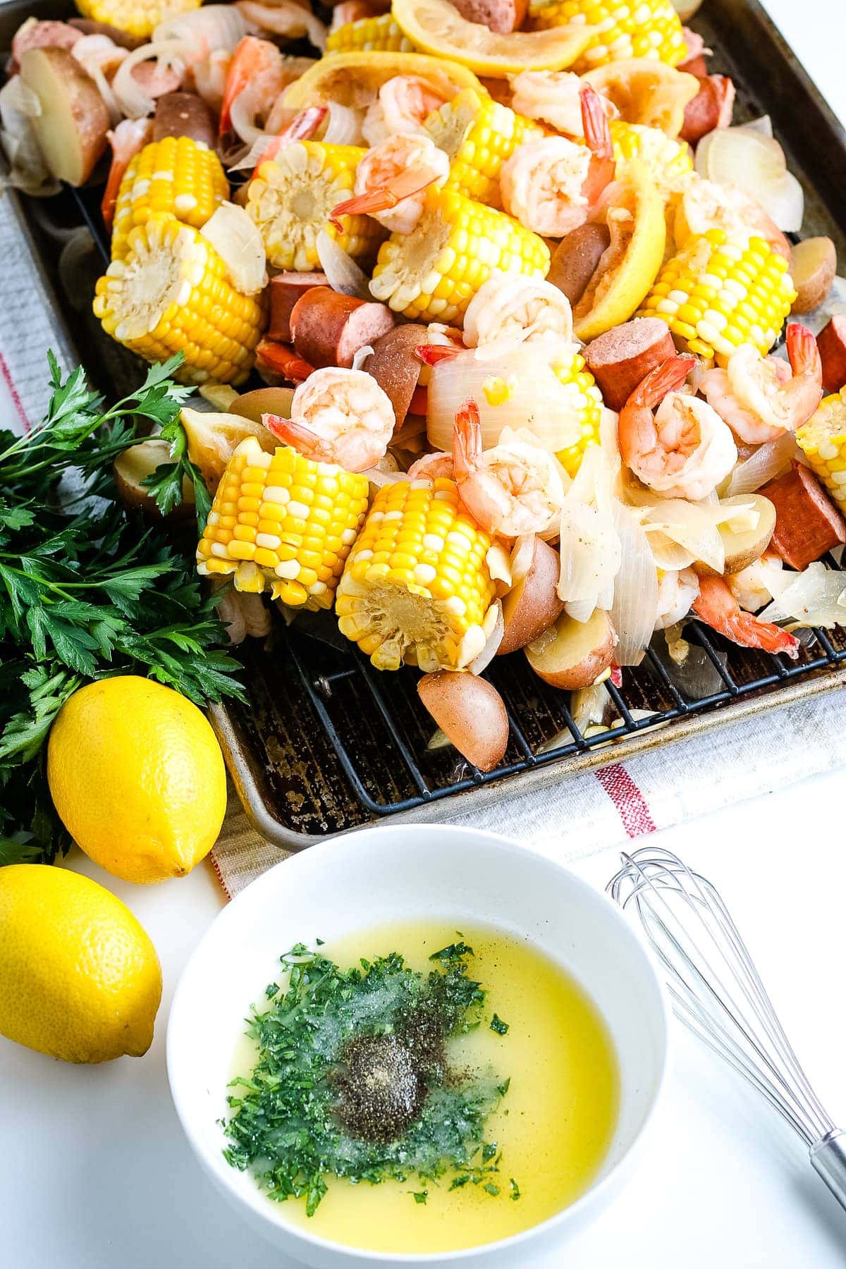 White bowl with ingredients for butter sauce before mixing and pouring on shrimp boil.