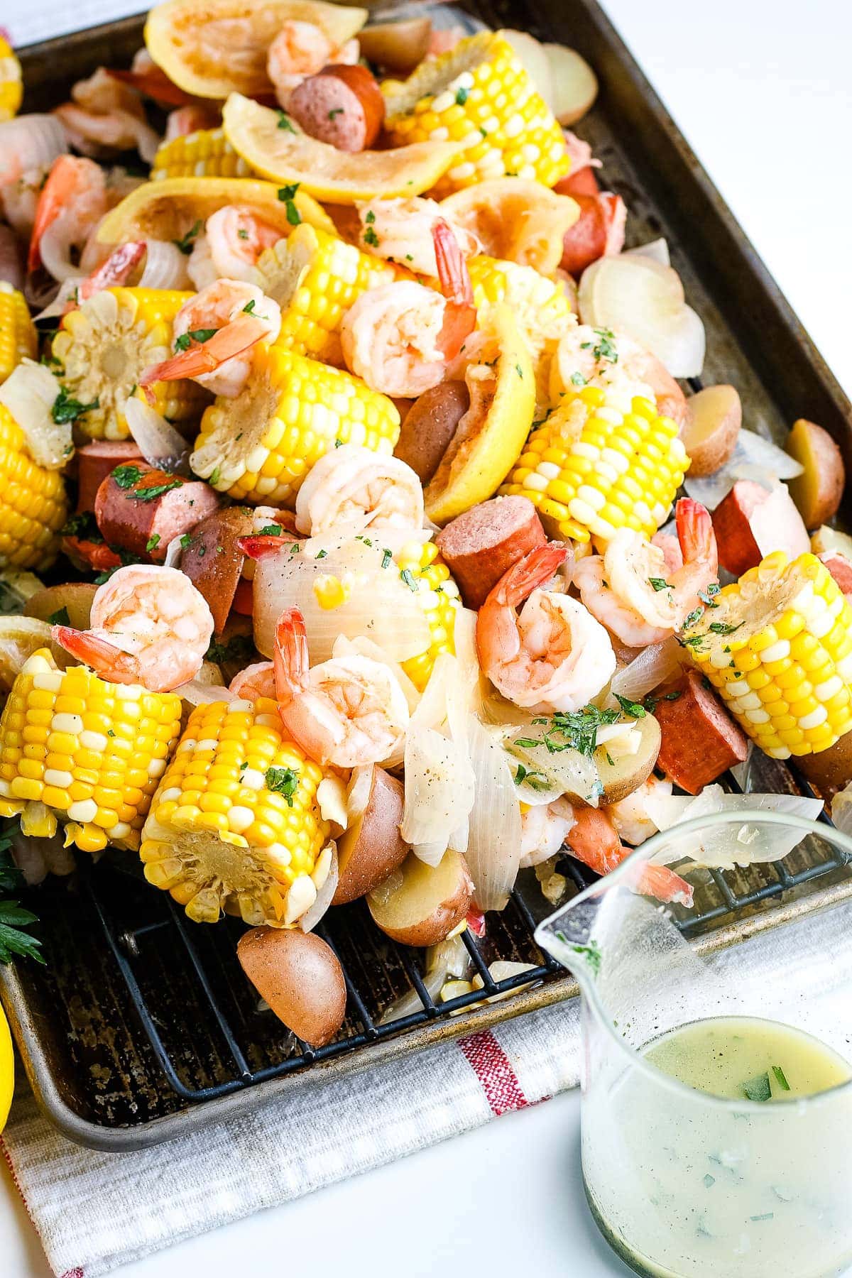Shrimp Boil cooked and poured out onto a sheet pan.