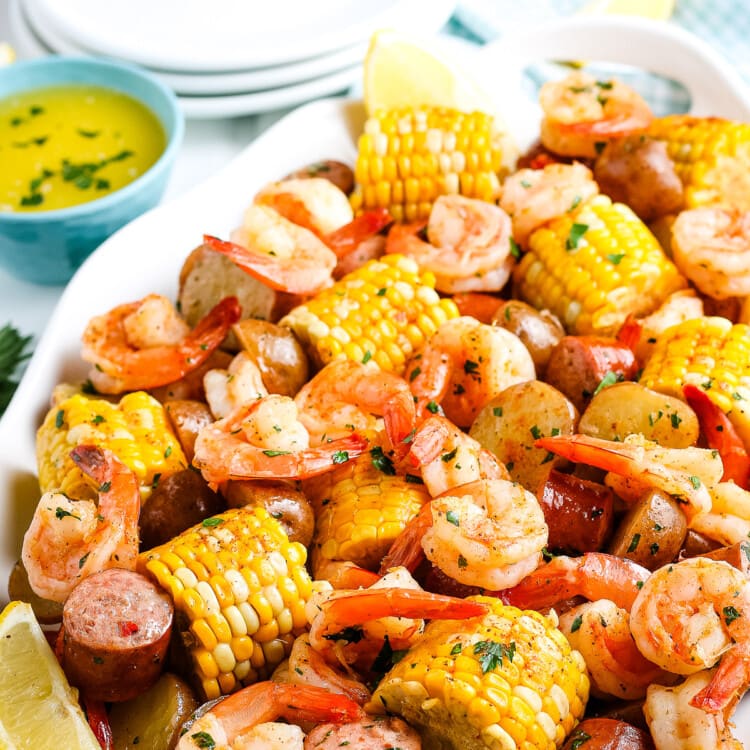Shrimp Boil on what platter with white plates and napkin in background