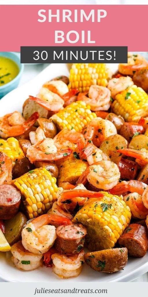 Pin Image for Shrimp Boil with text overlay of recipe name on top and a photo below showing it on a white serving platter.