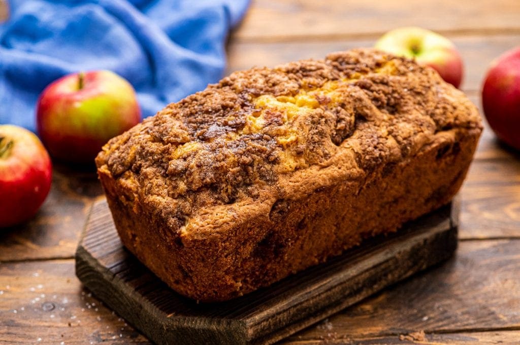 Loaf of Apple Bread on wooden cutting board