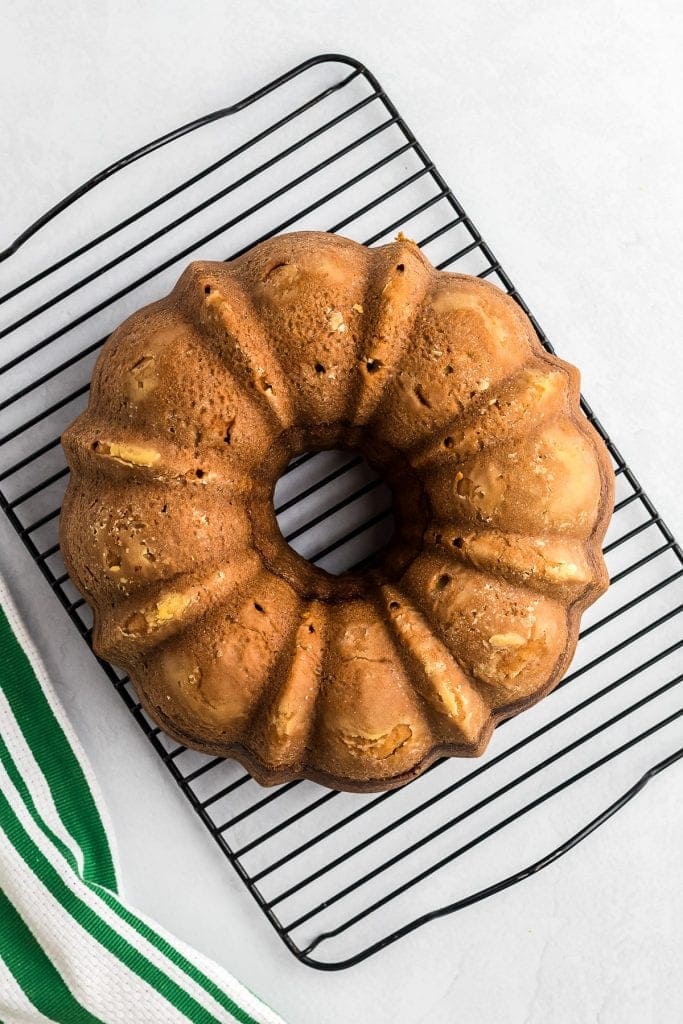 Zucchini Bundt Cake flipped out of pan and cooling on wire rack.