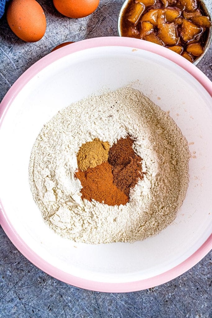 Dulce de Leche Apple Poke Cake dry cake mix ingredients in bowl before mixing.