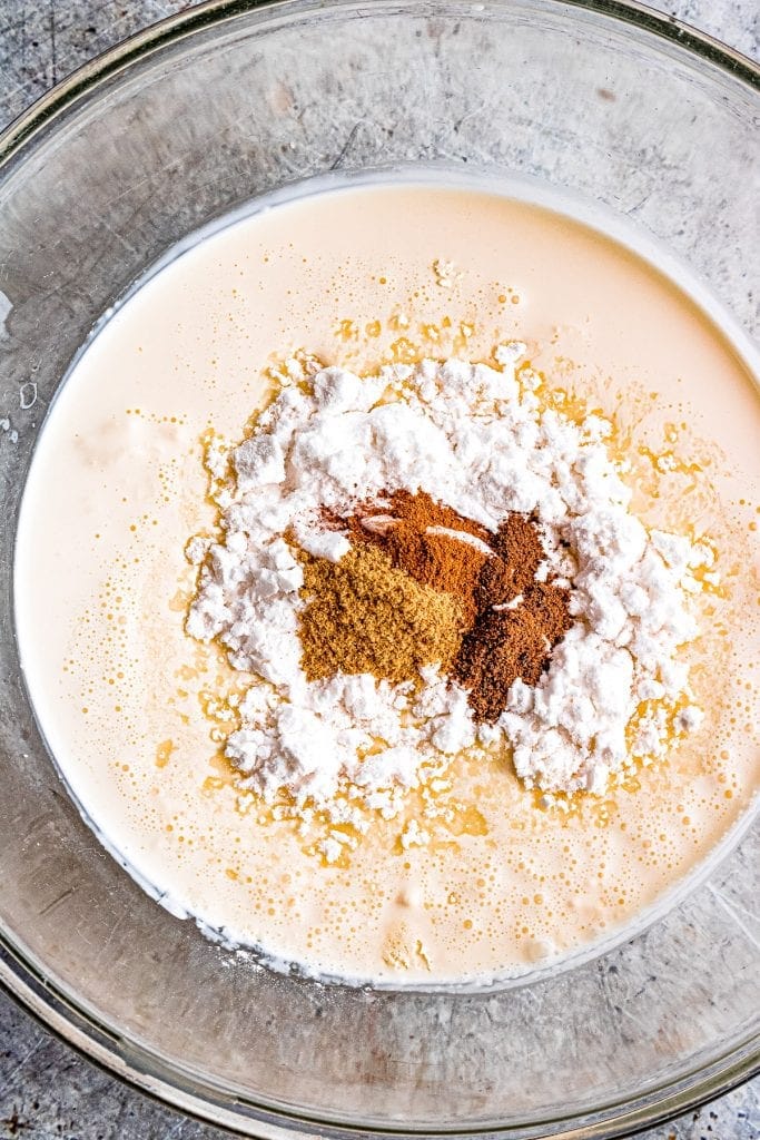 Dulce de Leche Apple Poke Cake whipped cream ingredients in glass bowl