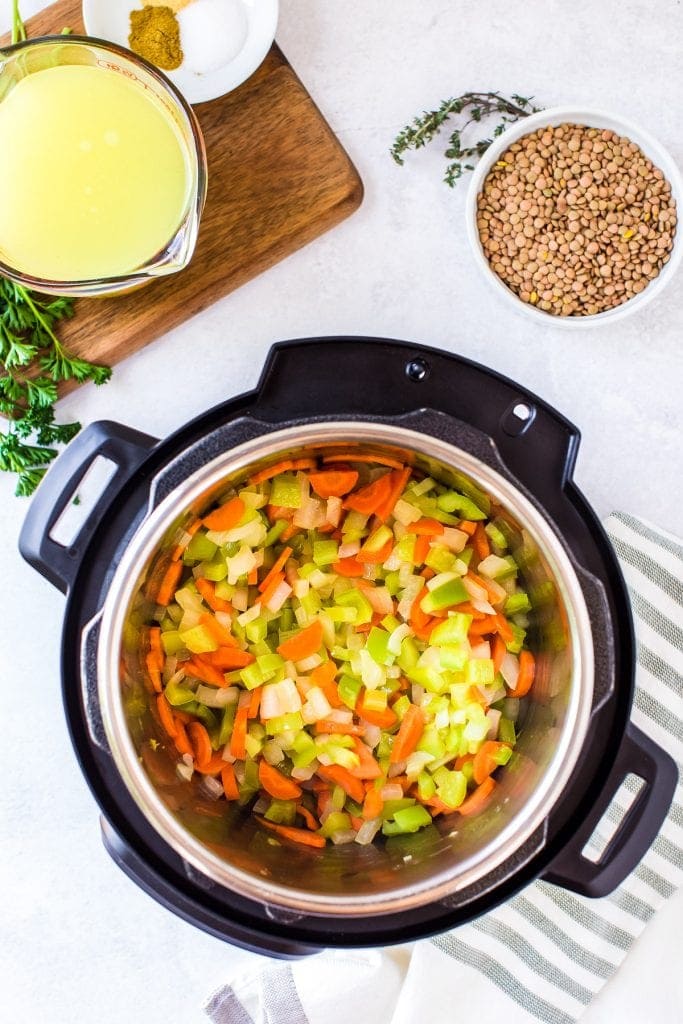Instant Pot with sauteed onions, celery and carrots.