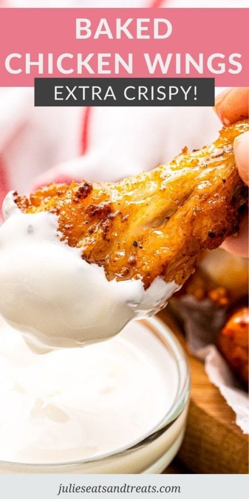 Pinterest image with text overlay of Baked Chicken Wings on top and photo of a wing dipped in ranch on bottom