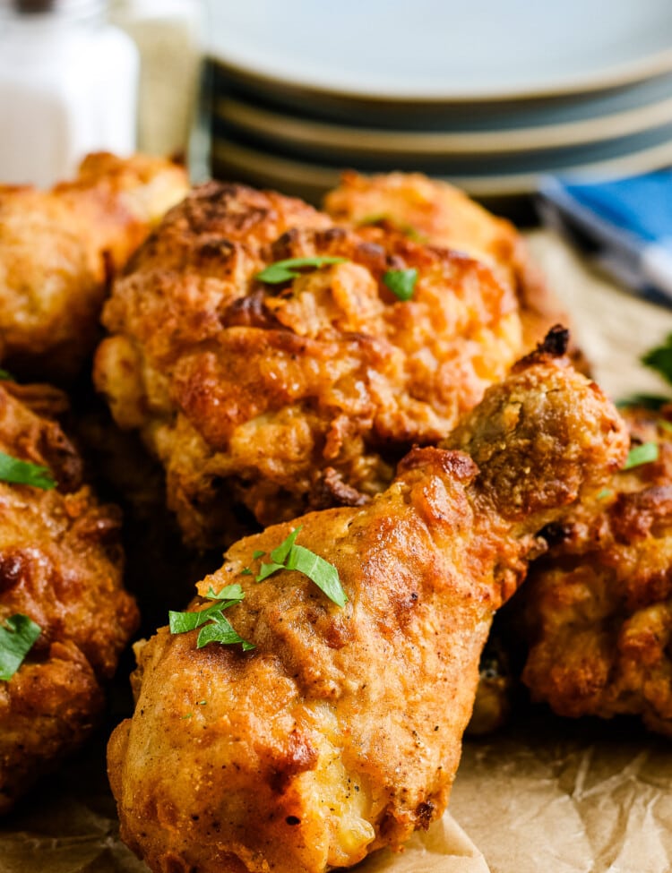 Air Fryer Fried Chicken laying on brown paper background.