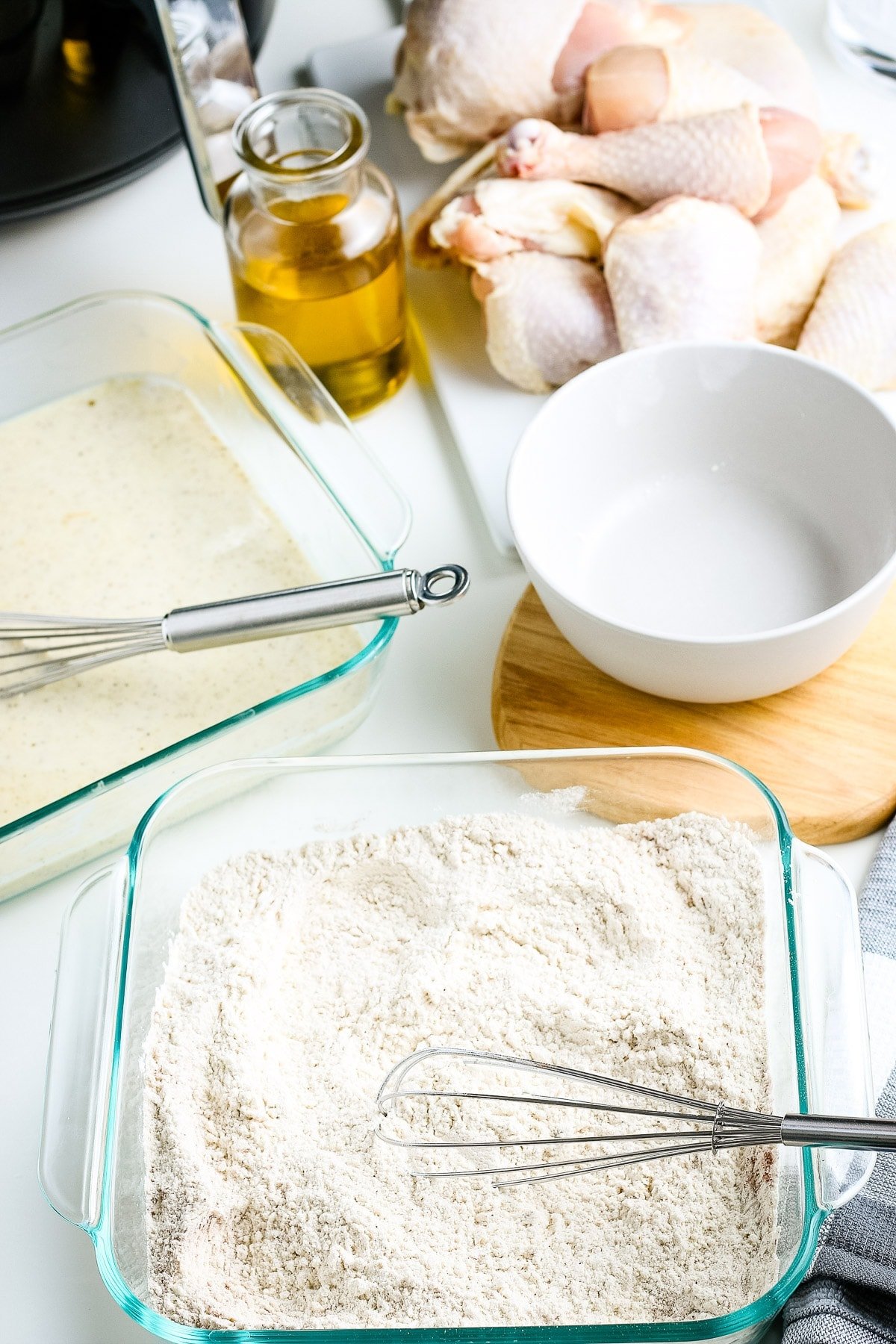 Fried Chicken Coating in clear square baking dish after mixing.