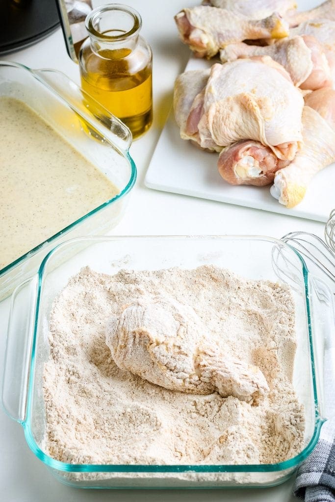 Chicken Leg in glass baking dish coated.