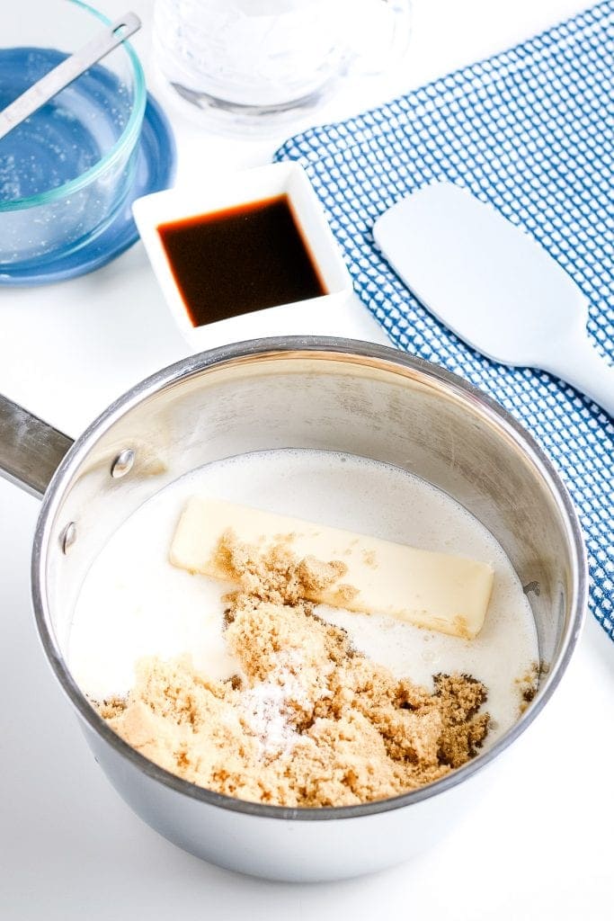 Saucepan with ingredients to make caramel sauce.