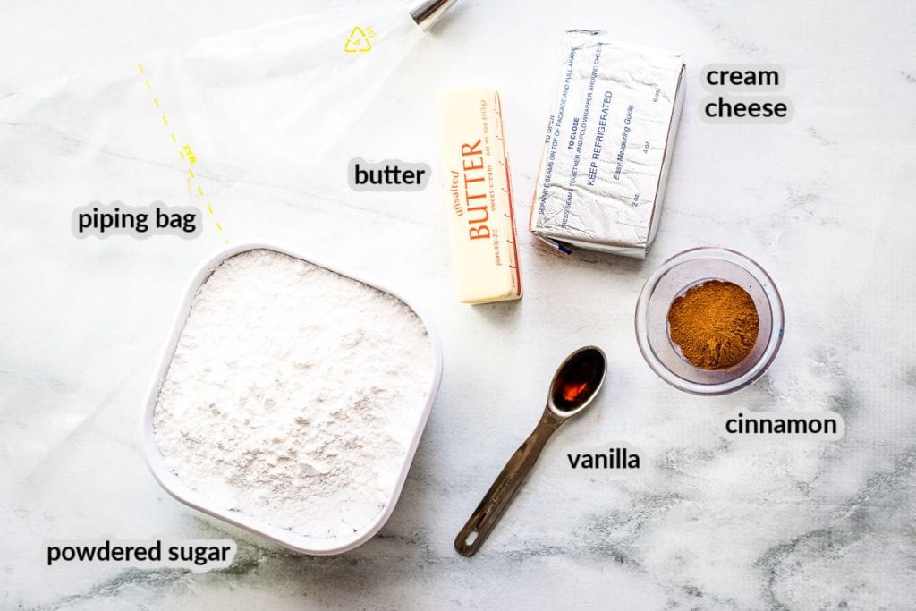 Overhead image of Pumpkin Cupcakes with Cinnamon Cream Cheese Ingredients with labels