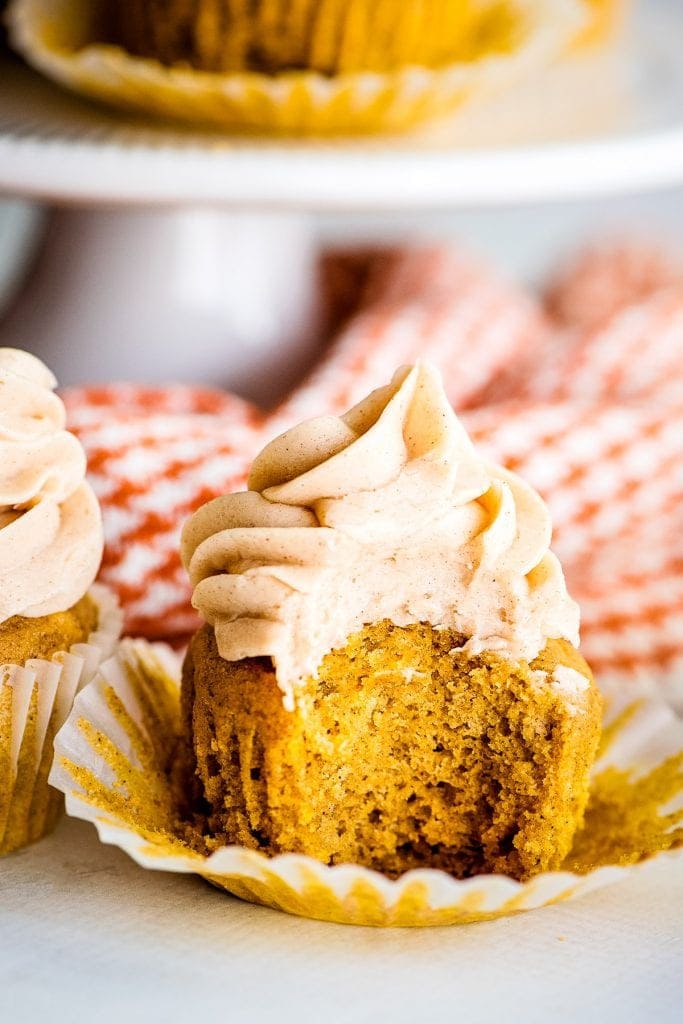 Pumpkin Cupcakes unwrapped and a bite taken out of it