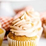 Close up image of a frosted pumpkin cupcake