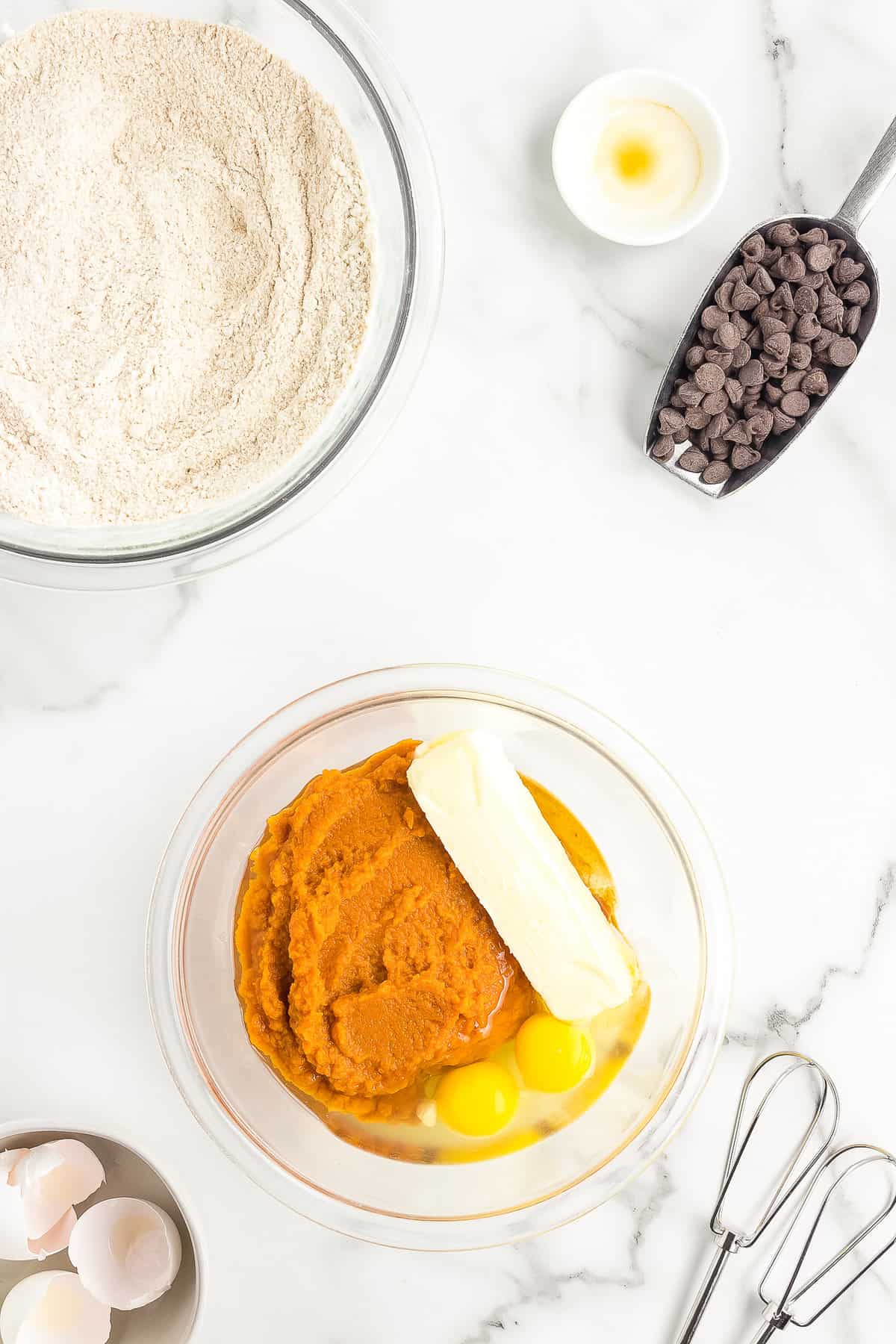 Wet ingredients in bowl for pumpkin muffins