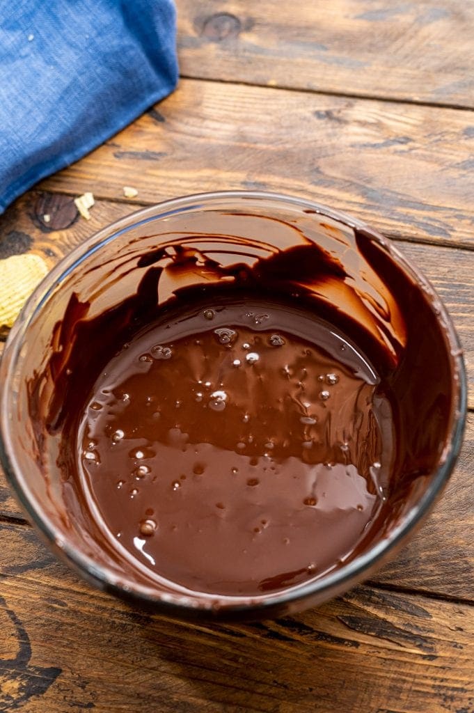 Glass bowl with melted chocolate in it.