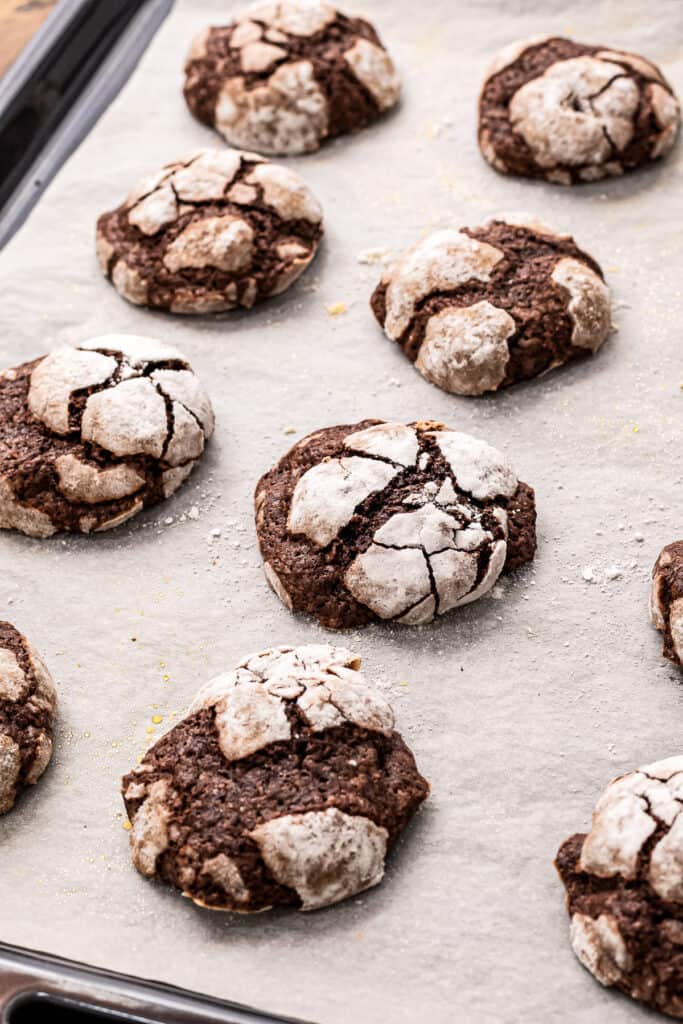 Baked Chocolate Crinkle Cookies on baking sheet