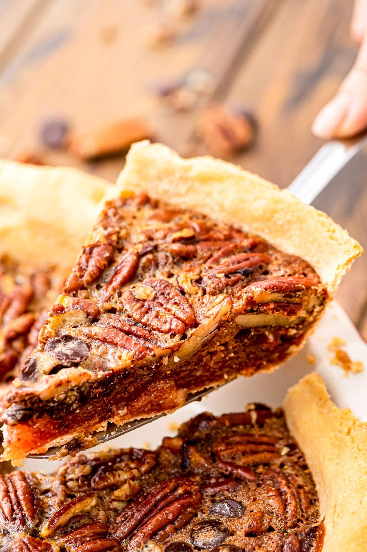 Slice of Chocolate Pecan Pie on pie server