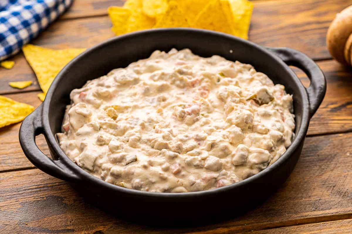 Cast iron skillet with cream cheese sausage dip in it