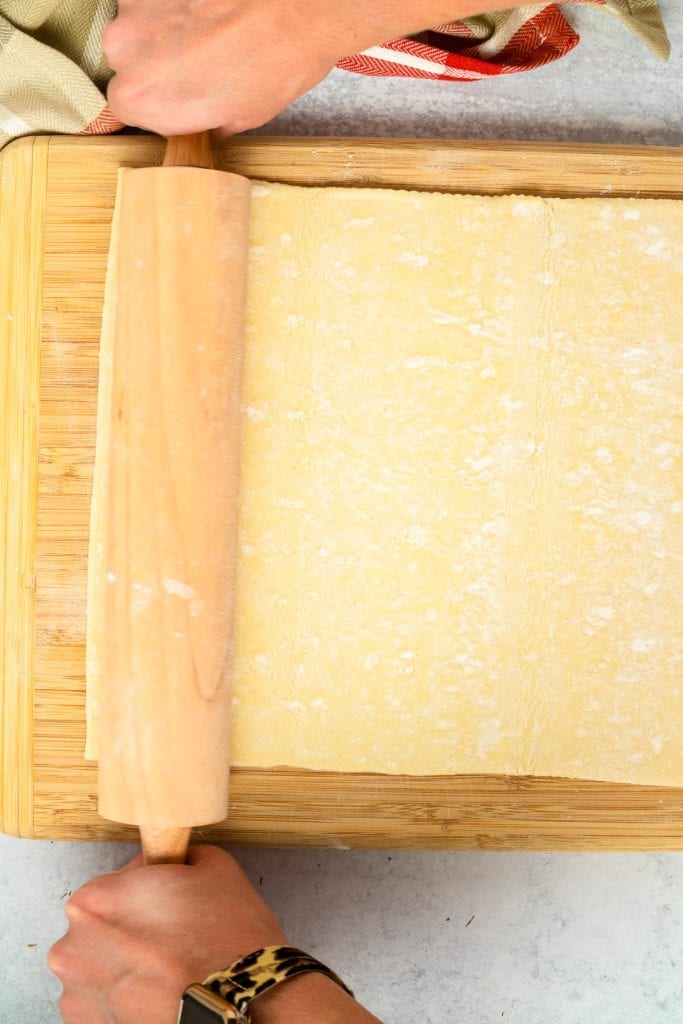 Puff Pastry Crust being rolled out with rolling pin