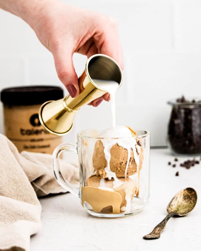 Pouring shot of liquor into Affogato