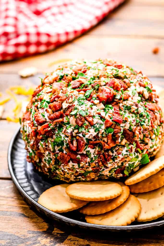 Bacon Ranch Cheese Ball with crackers on a blue plate