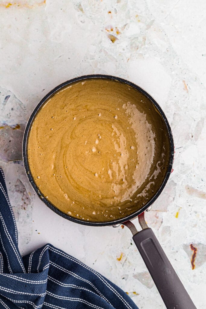 Saucepan with prepared caramel sauce