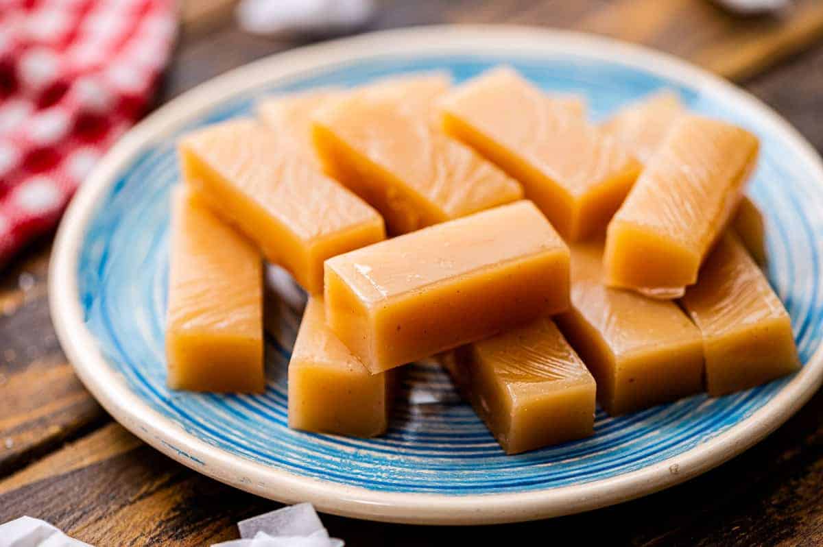 A blue plate with cute pieces of homemade caramels