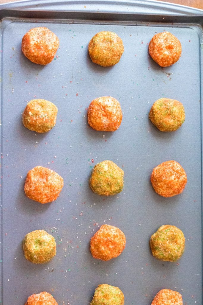 Sheet pan with balls of Christmas Snickerdoodles dough on it