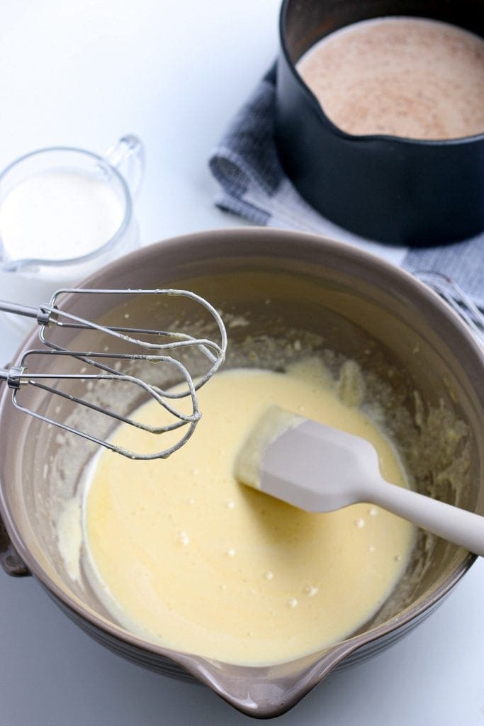 Bowl with creamed egg yolks and sugar in it