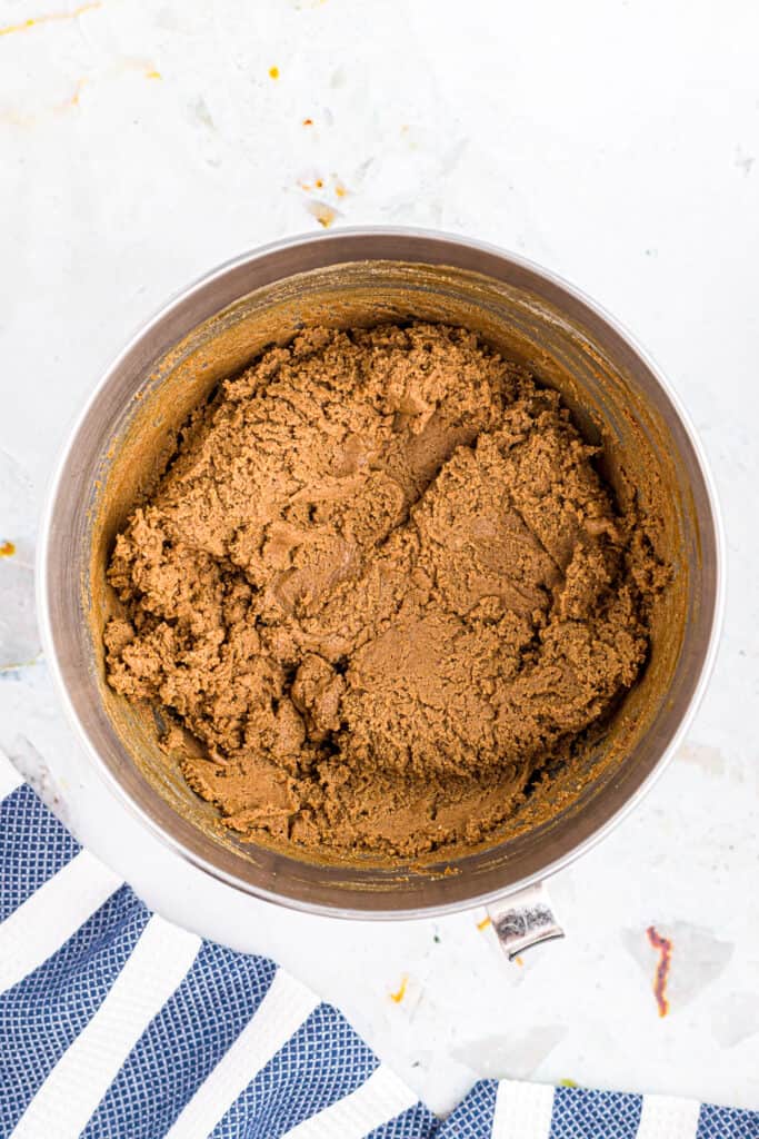 Overhead image of molasses cookie dough mixed together