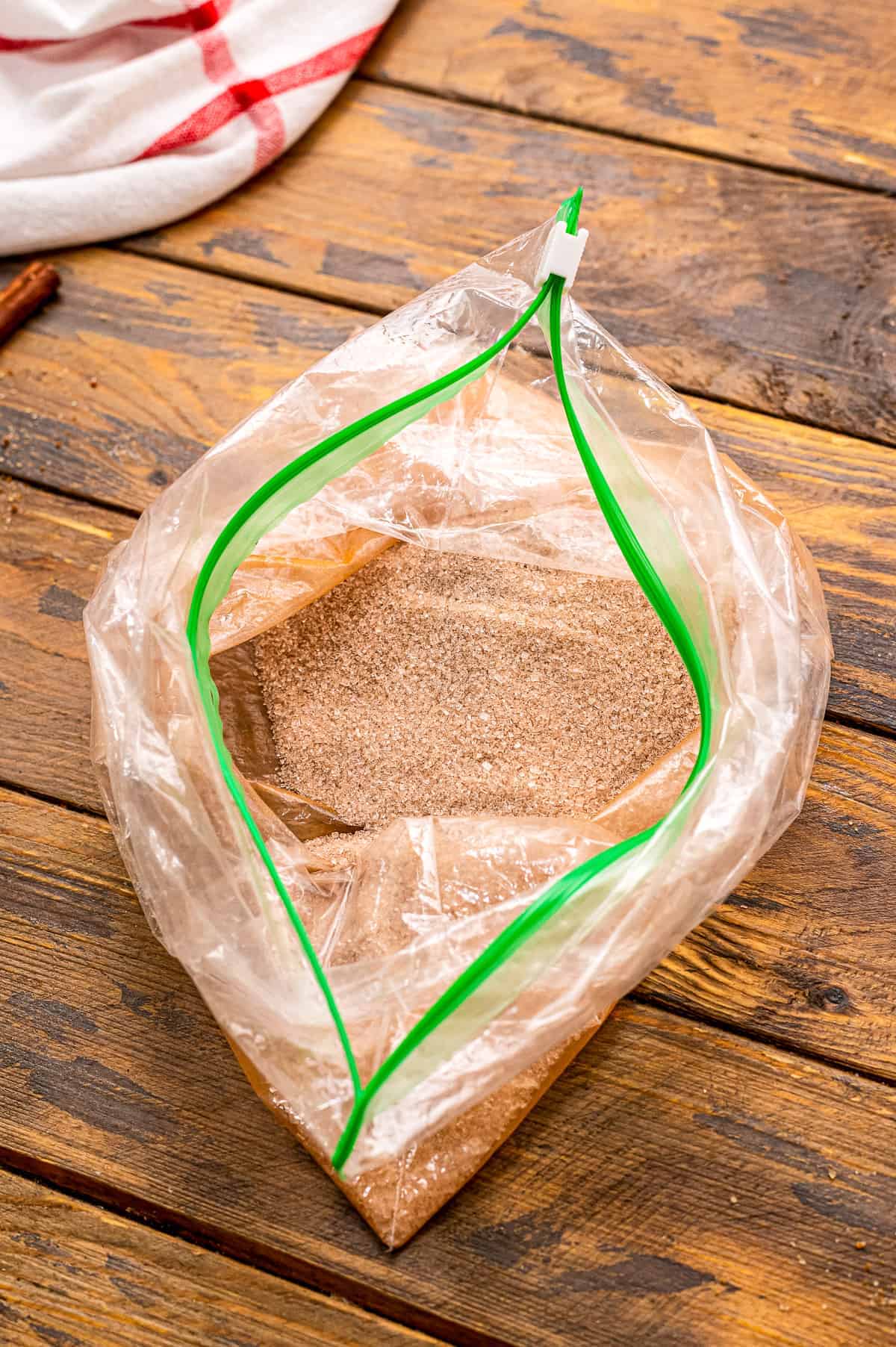 A cinnamon sugar mixture in resealable plastic bag