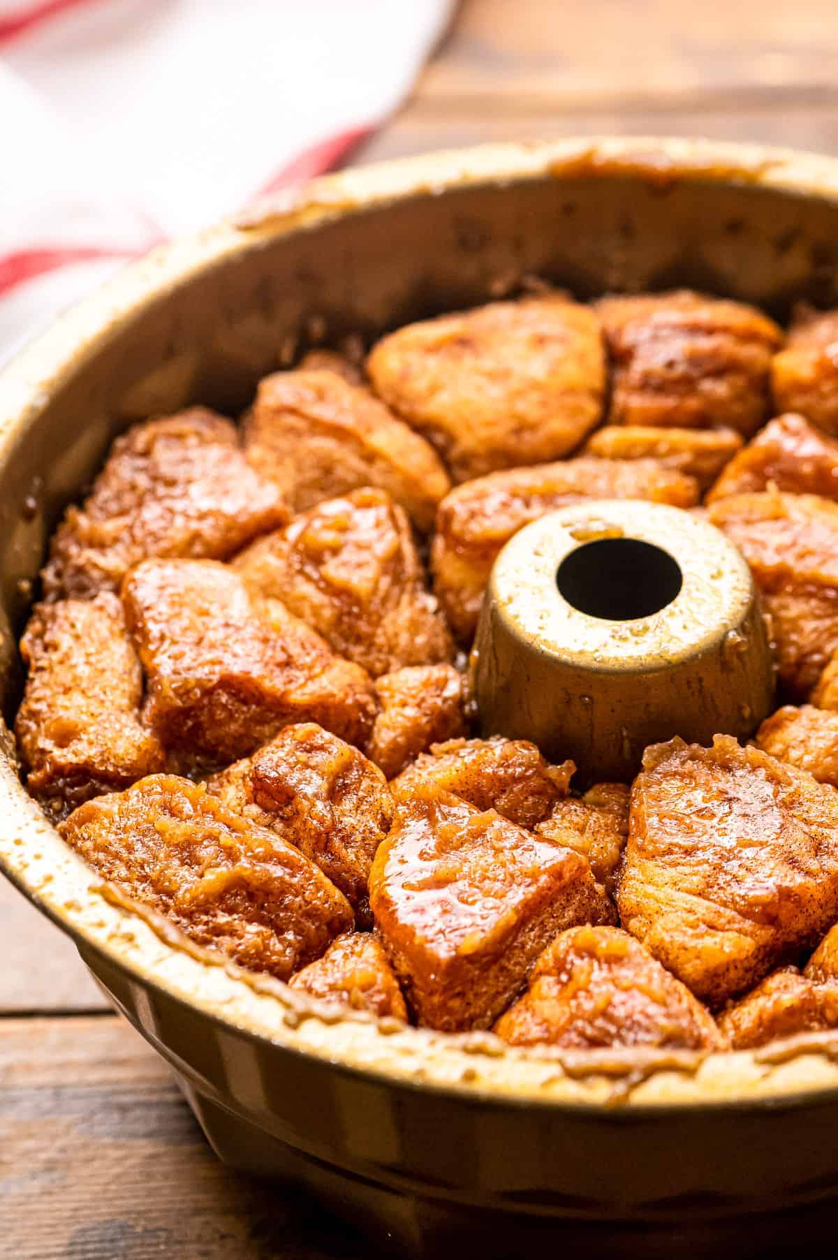 A close up image of bundt pan with baked monkey bread in it.