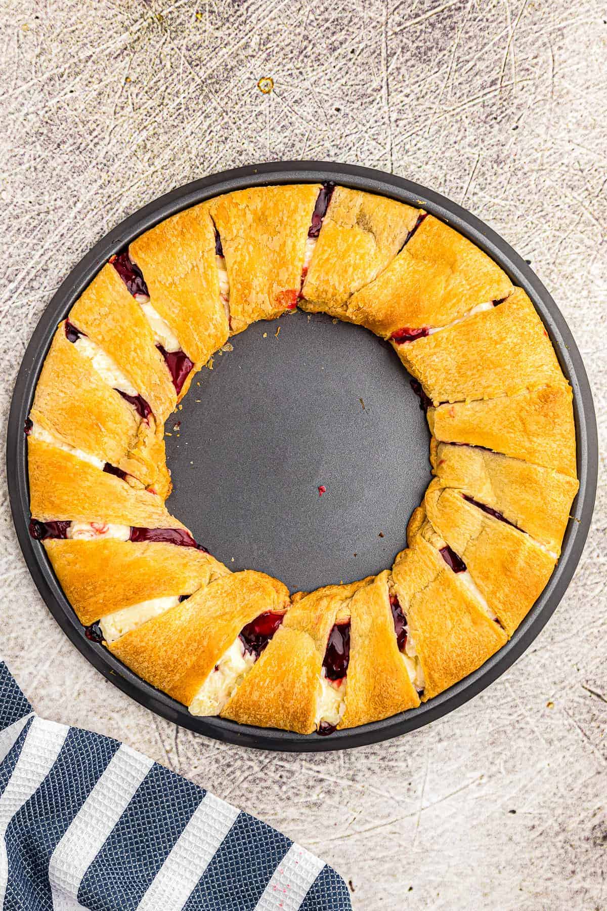 Strawberry Cheesecake Crescent Ring baked on pizza pan