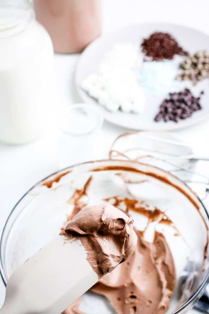 Spatula with whipped hot chocolate on it.