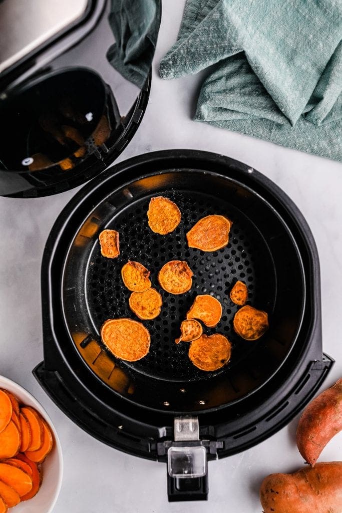 Sweet potatoes in air fryer basket after cooking