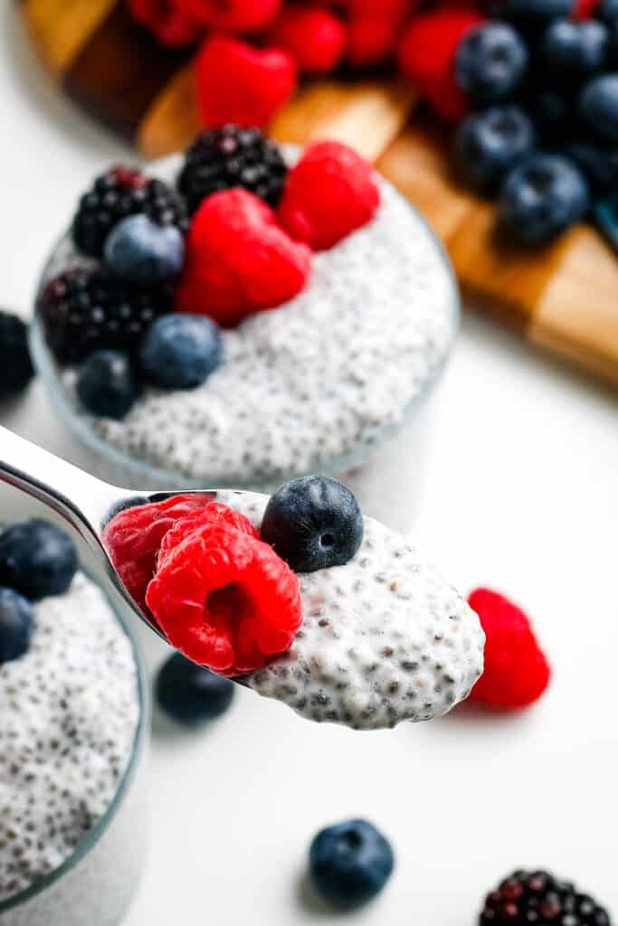 Spoonful of Chia Pudding topped with berries