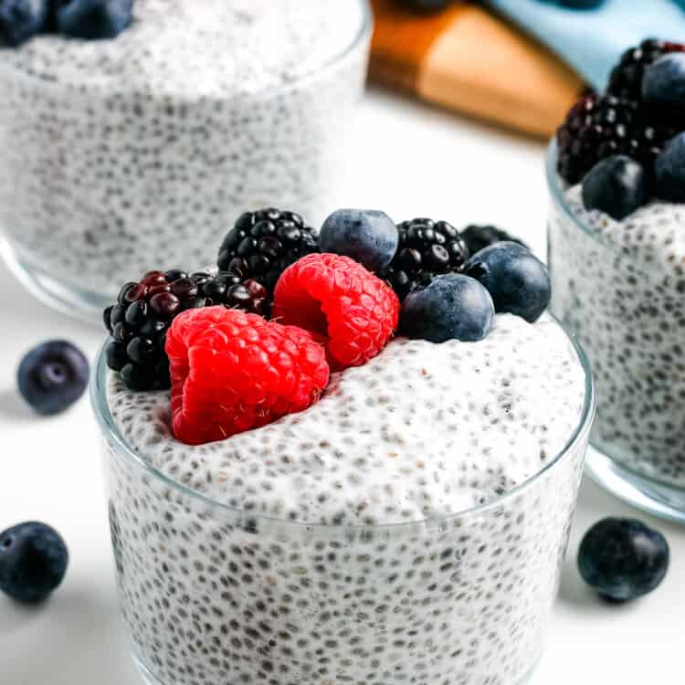 Glass bowl of Chia Pudding topped with berries